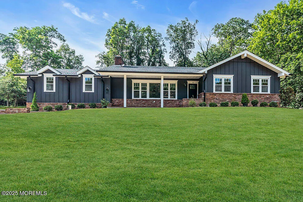 Staged 4-bedroom renovated ranch home in Colts Neck NJ featuring a spacious residential setting on a large 0.92-acre property.
